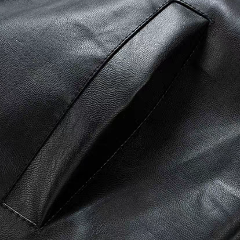 Close-up of black faux leather pocket detail on men's racing moto jacket