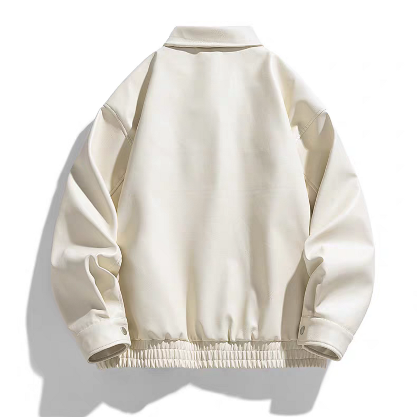 Back view of the STVLE white varsity jacket, highlighting the clean panel design, elastic hem, and structured silhouette in soft PU leather