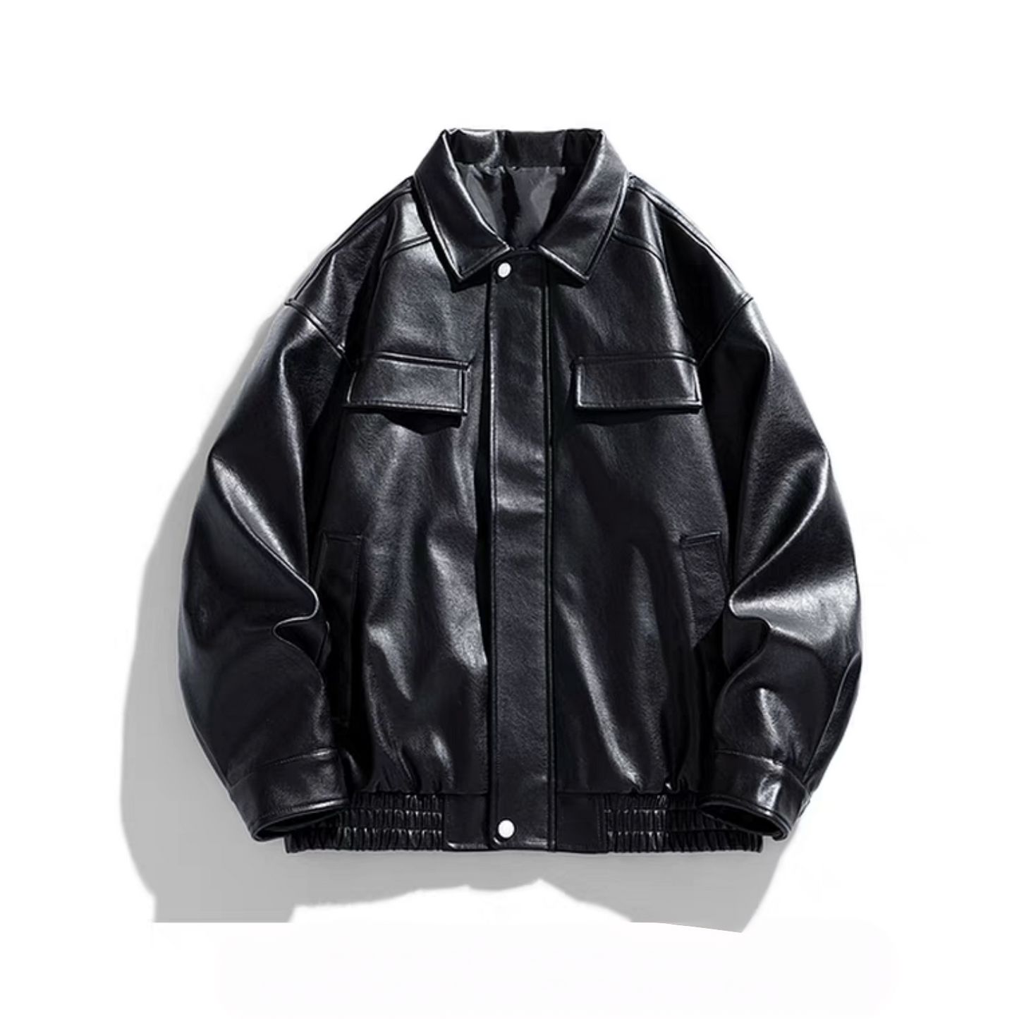 Front view of STVLE black PU leather varsity jacket – oversized streetwear fit with flap pockets and ribbed hem