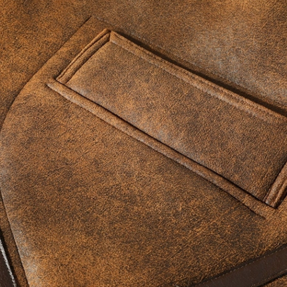 Close-up of brown faux suede aviator jacket side pocket with clean stitching and vintage finish