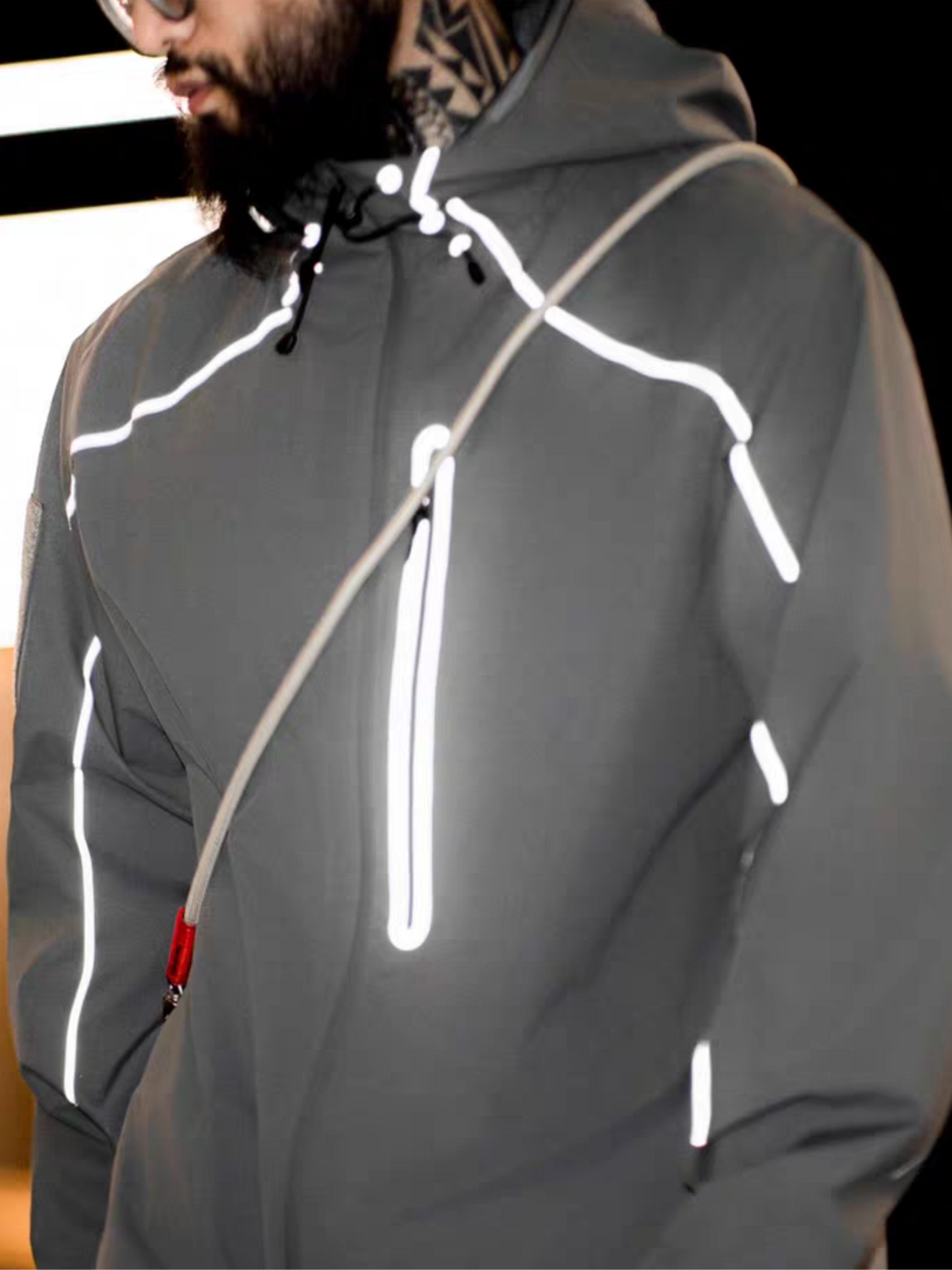 Half-body front view of model wearing STVLE lightsaber reflective tech jacket with white piping and zip details