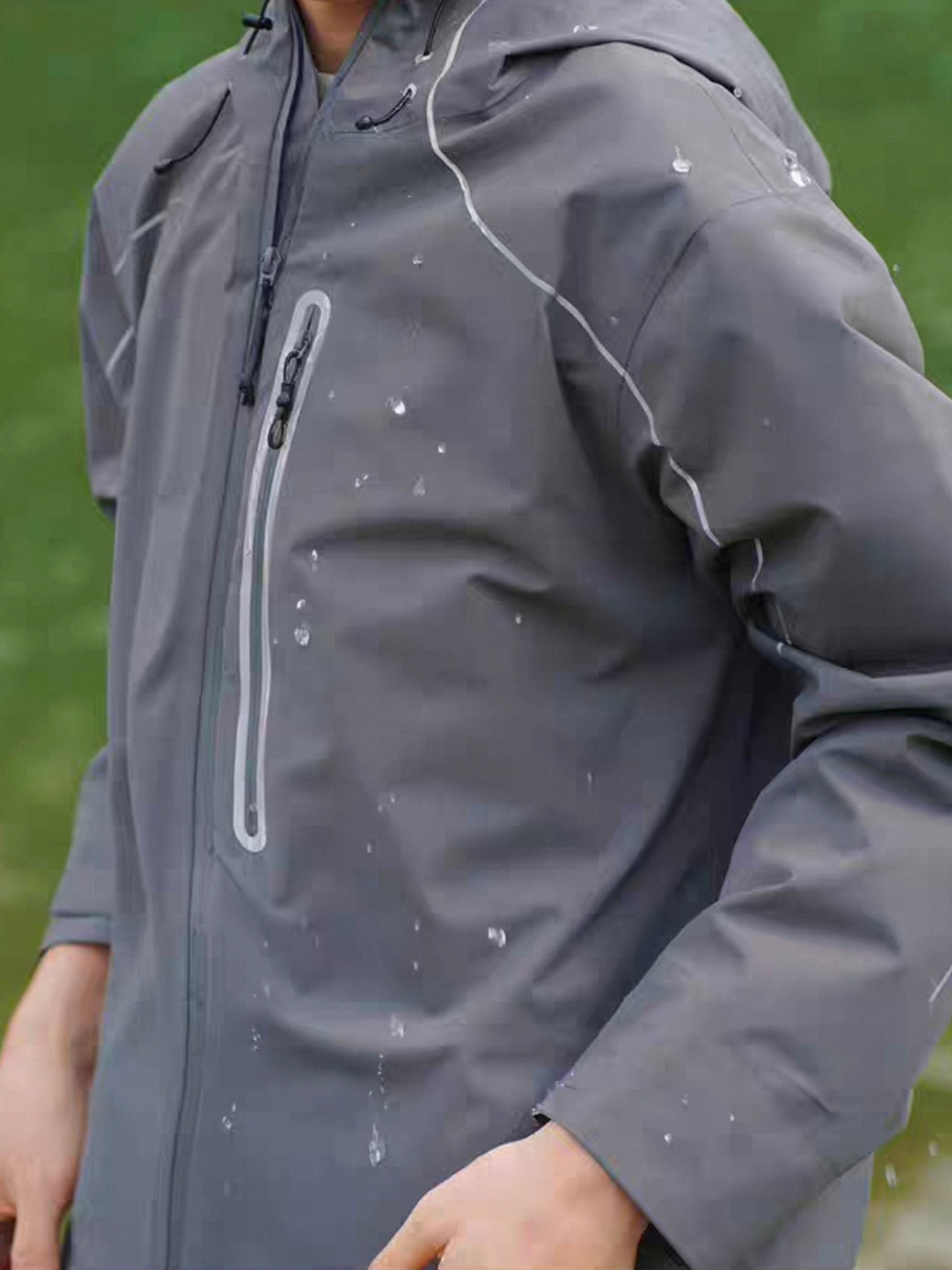Model wearing SVLE lightsaber reflective jacket outdoors, showcasing water-resistant surface and sleek techwear design