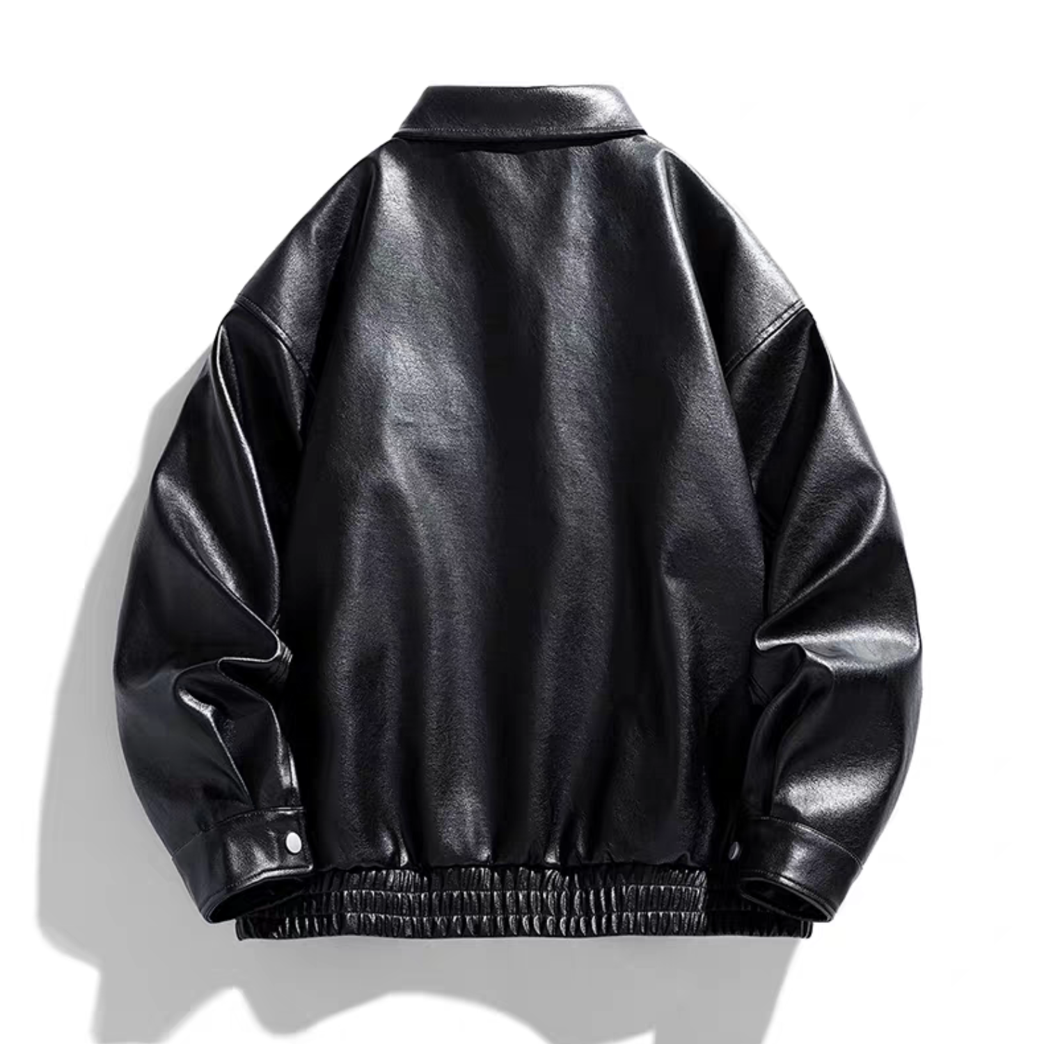 Back view of the STVLE black varsity jacket made from glossy PU leather, showcasing structured drop shoulders, elastic cuffs, and hem design