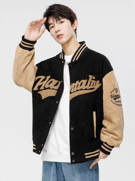 Model wearing black retro varsity jacket in suede