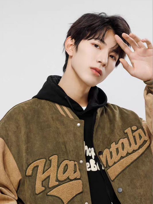 Model styling green suede varsity jacket with oversized fit